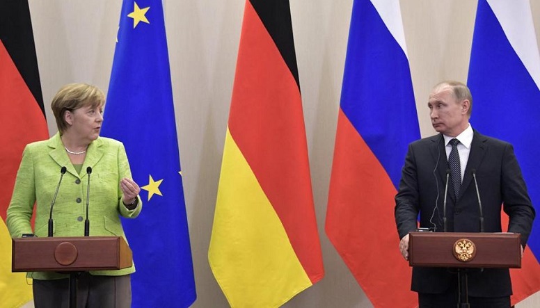 Merkel at a press conference after meeting with Putin