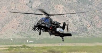 Raytheon Company -helicopter-based firing of High Energy Laser